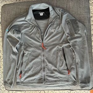 Arc’teryx men’s large waffle knit zip jacket with pockets and one sleeve pocket.